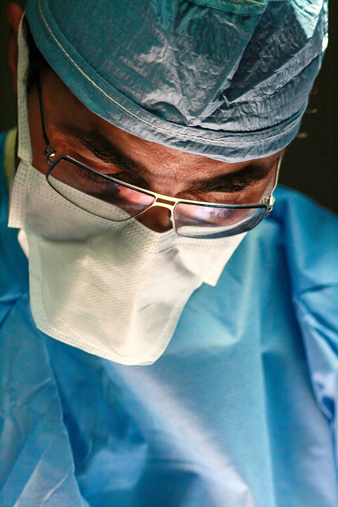 Close-up of a liposuction surgeon in the operating room